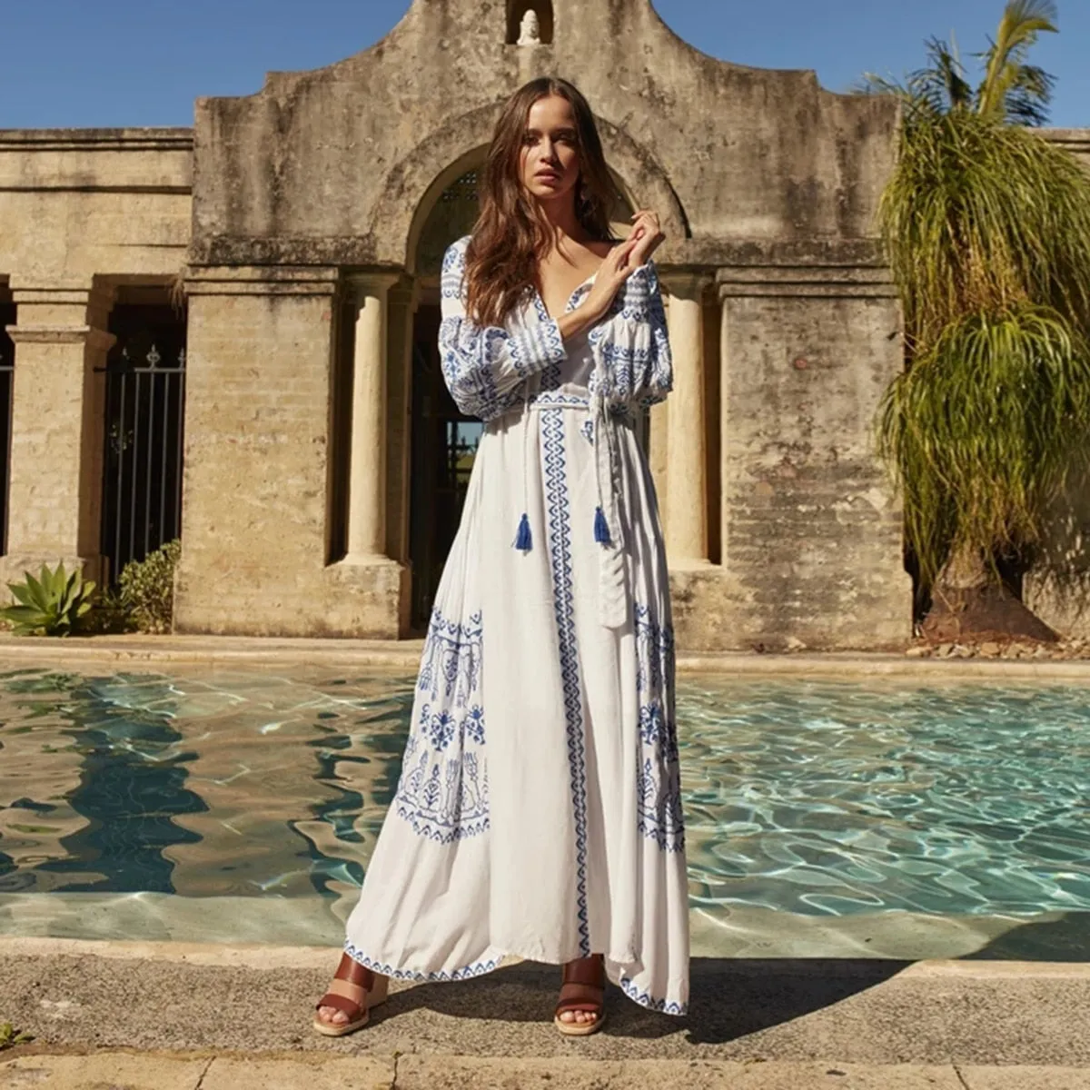 Bahia Maxi Dress White With Blue Embroidery Long Puffed Peasant Sleeves Embroidered Pockets Bohemian Tassel Ties Available In Small Medium Large Or XL